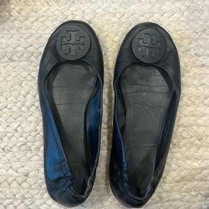 Black Tory Burch flats with matte black hardware